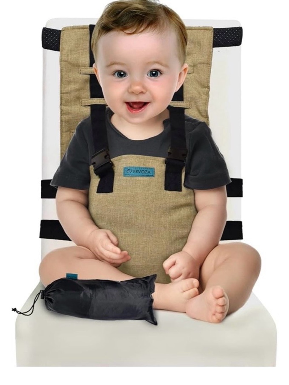 Portable baby chair seat harness in beige with black straps.”